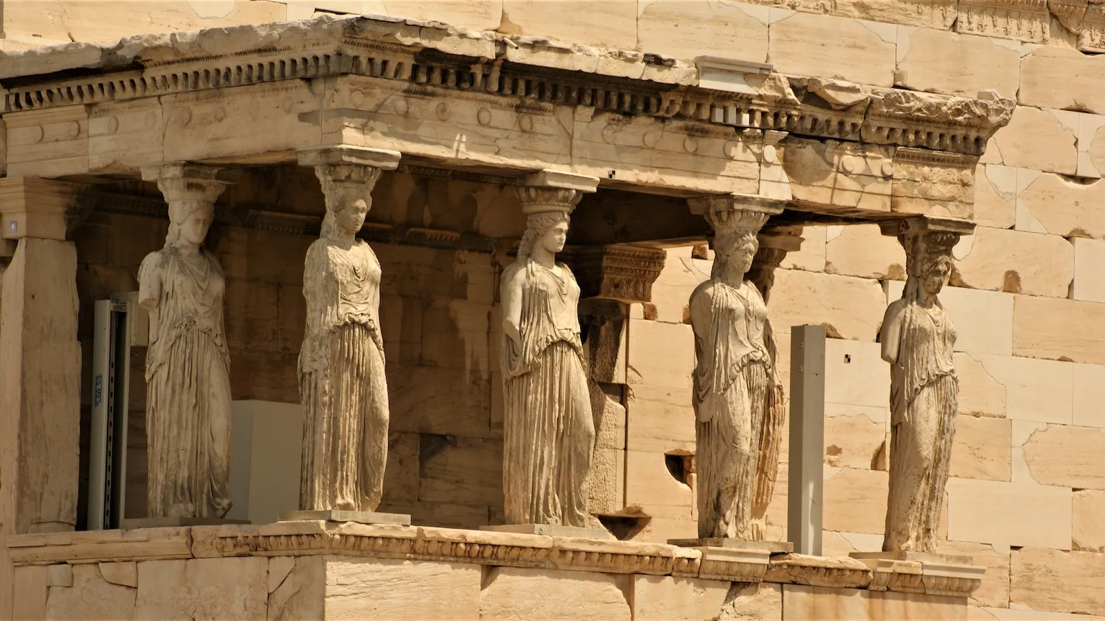 stone statues of women at the Acropolis of Athens