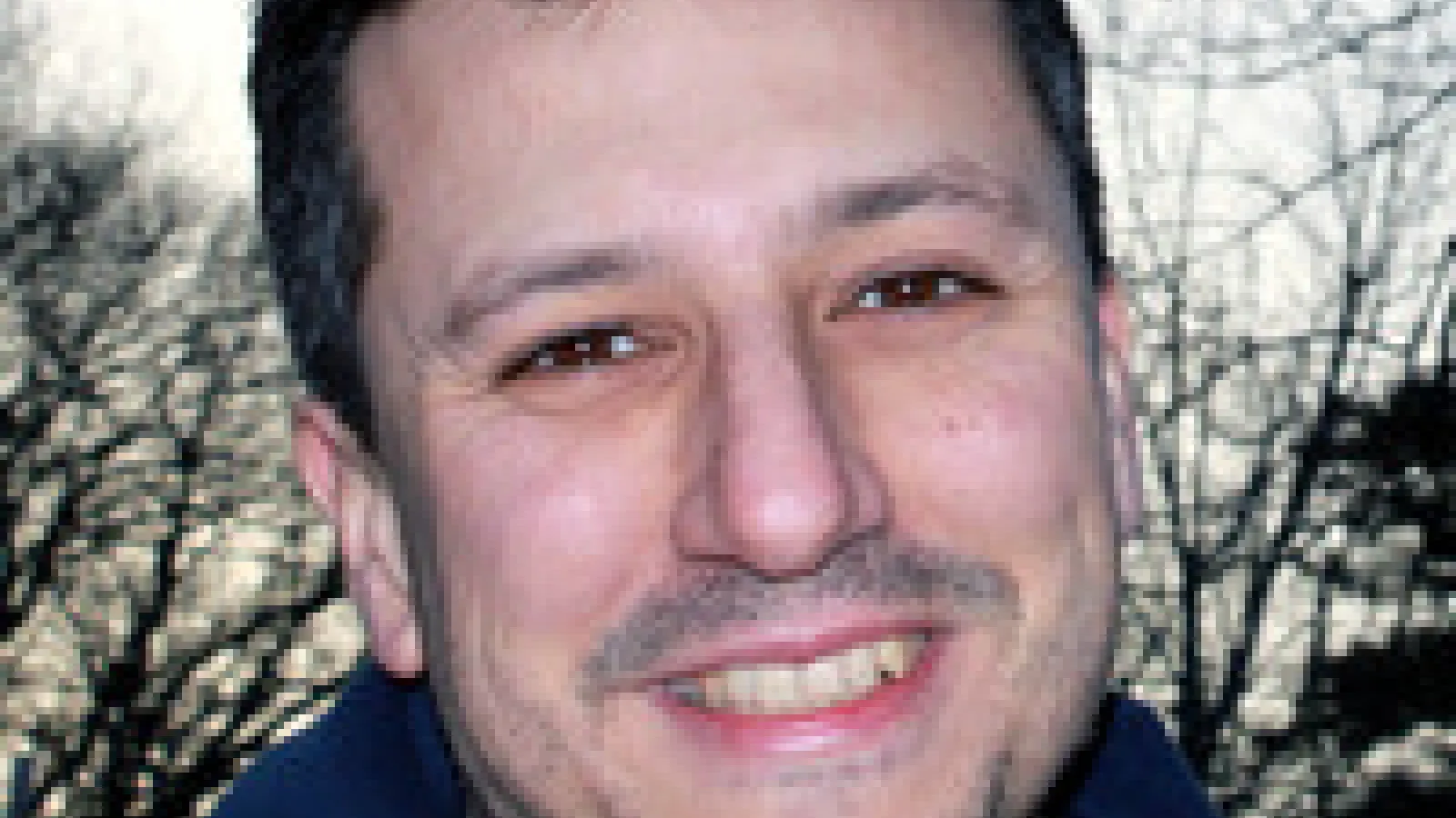 A headshot of the visiting lecturer.