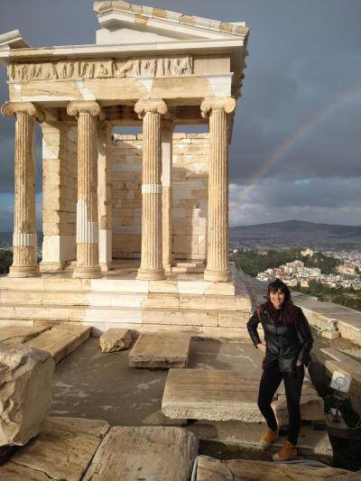 Photo of Aristogeneia in front of the Temple of Athena Nike in Greece