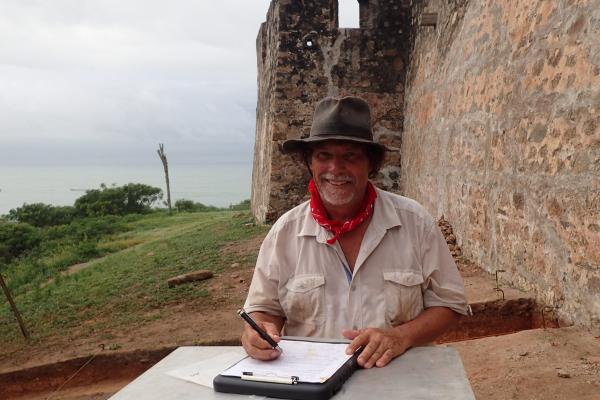 Professor Christopher DeCorse at an archeological site