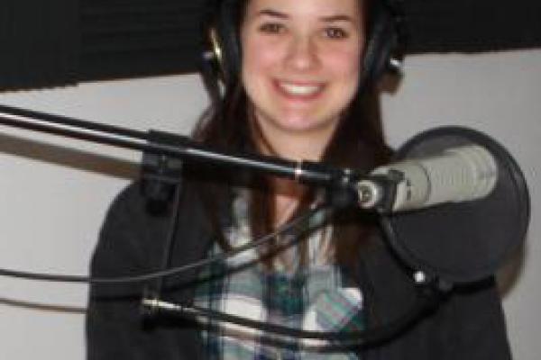 Modern Greek student with radio microphone