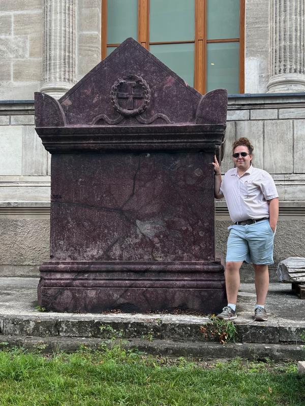 Me standing with one of the porphyry sarcophagi 