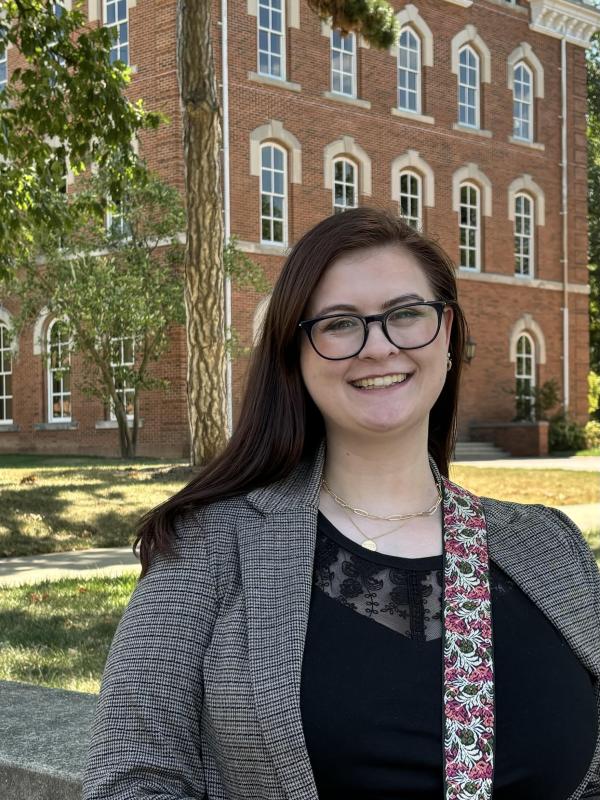 Dr. Knodel stands in front of University Hall